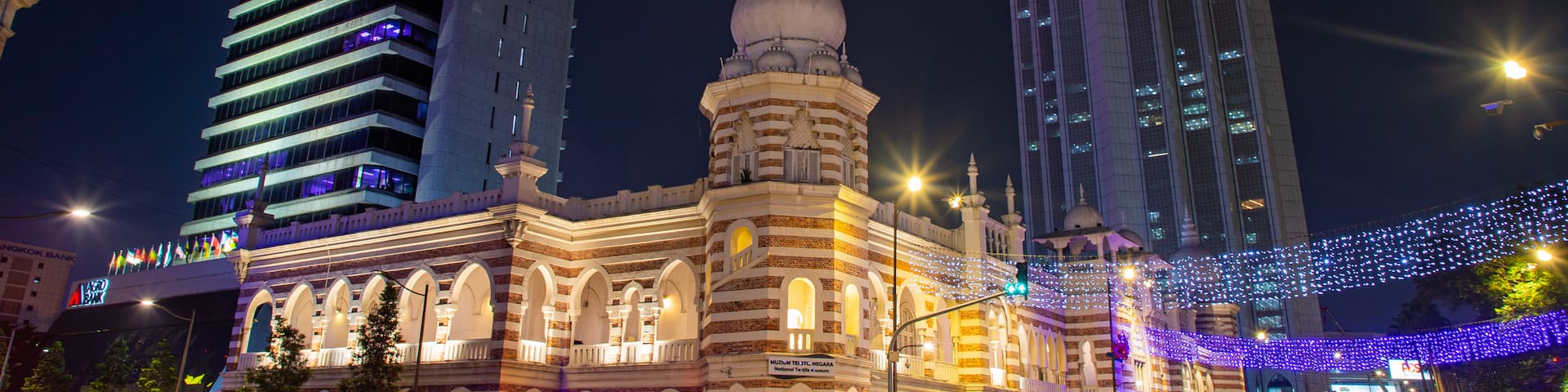 Merdeka Square featuring night scenes, a city and heritage architecture