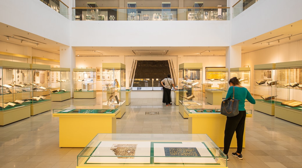 Islamic Arts Museum showing interior views as well as an individual femail