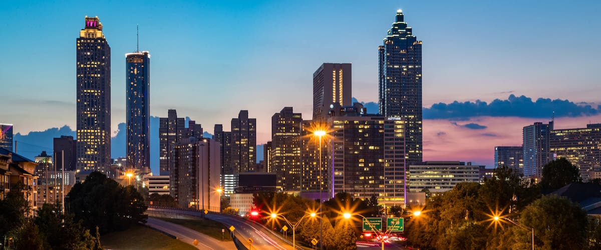Downtown Atlanta which includes landscape views, night scenes and a sunset