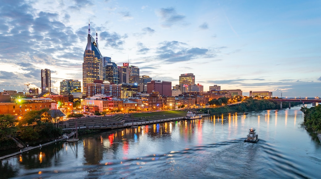 Downtown Nashville which includes a city, a sunset and boating