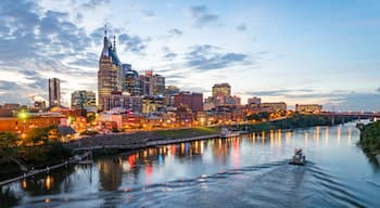 Downtown Nashville which includes a city, a sunset and boating