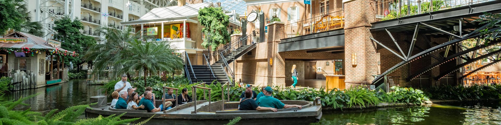 Opryland Hotel Gardens which includes a river or creek, interior views and boating