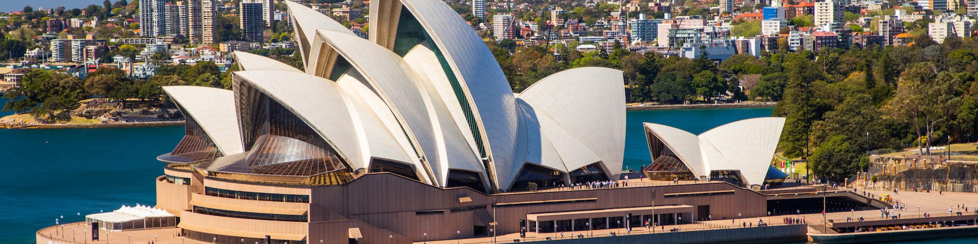 Sydney Opera House showing a bay or harbor, modern architecture and a monument