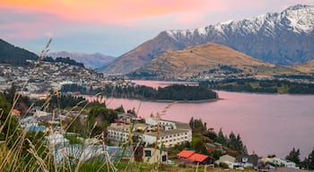 Queenstown featuring a sunset, a river or creek and mountains