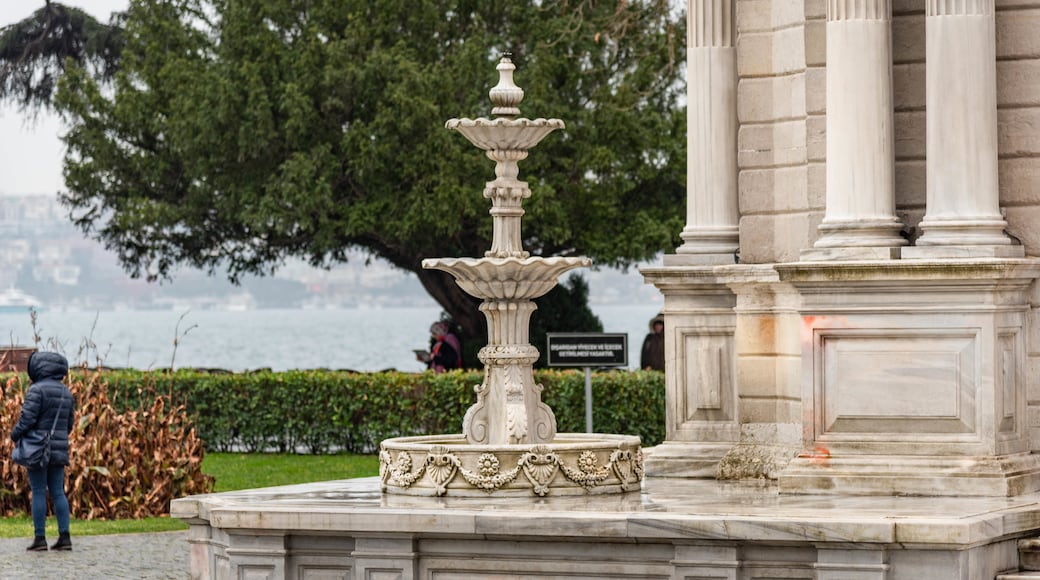 Dolmabahce Clock Tower which includes heritage elements and a fountain