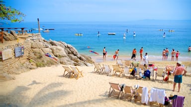 Puerto Vallarta showing a beach, general coastal views and kayaking or canoeing