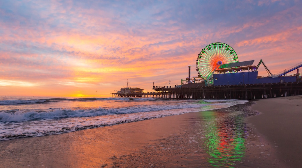 Santa Monica Pier featuring general coastal views, a sunset and a sandy beach