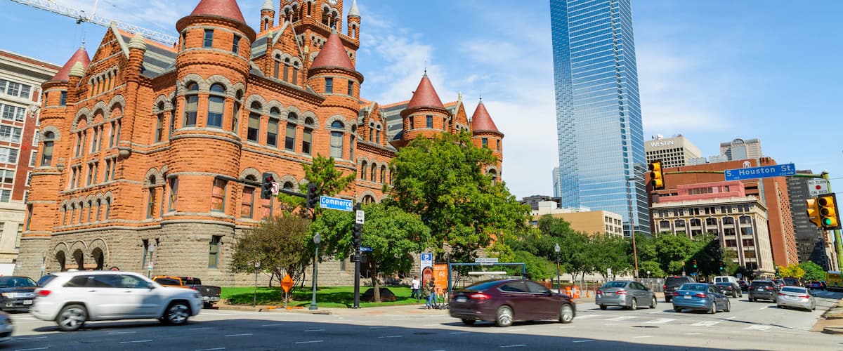 Dallas which includes a skyscraper and heritage architecture