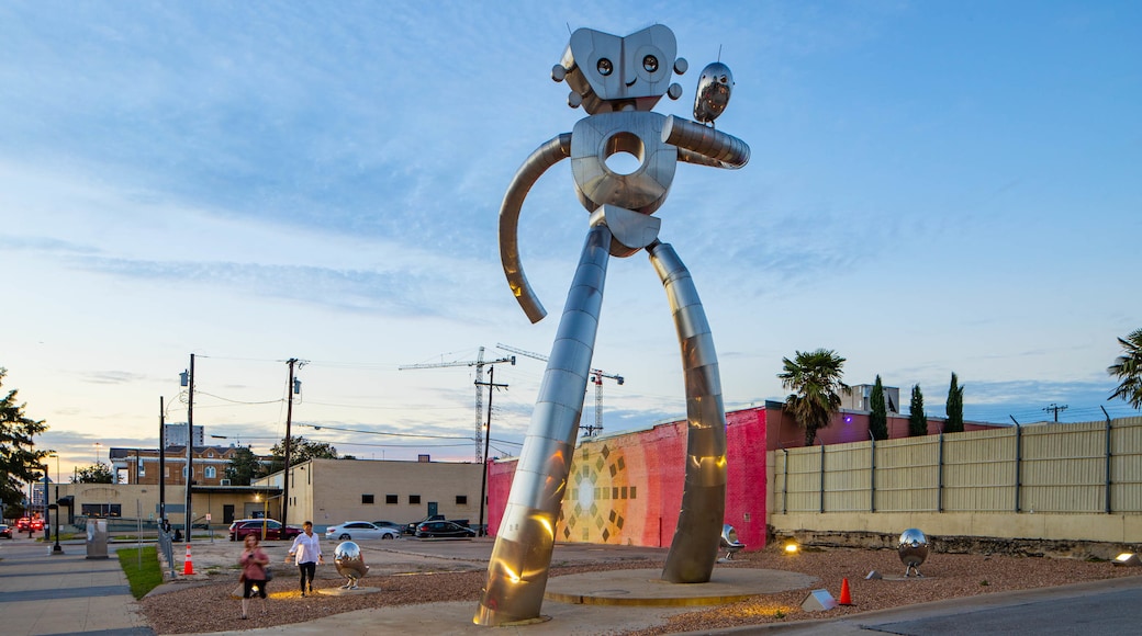 Deep Ellum showing outdoor art and a sunset