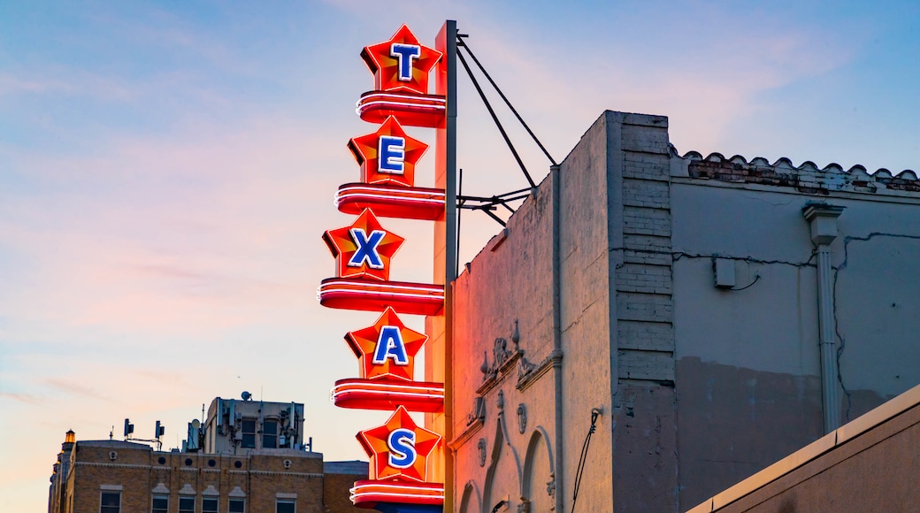 Texas Theatre which includes signage and a sunset