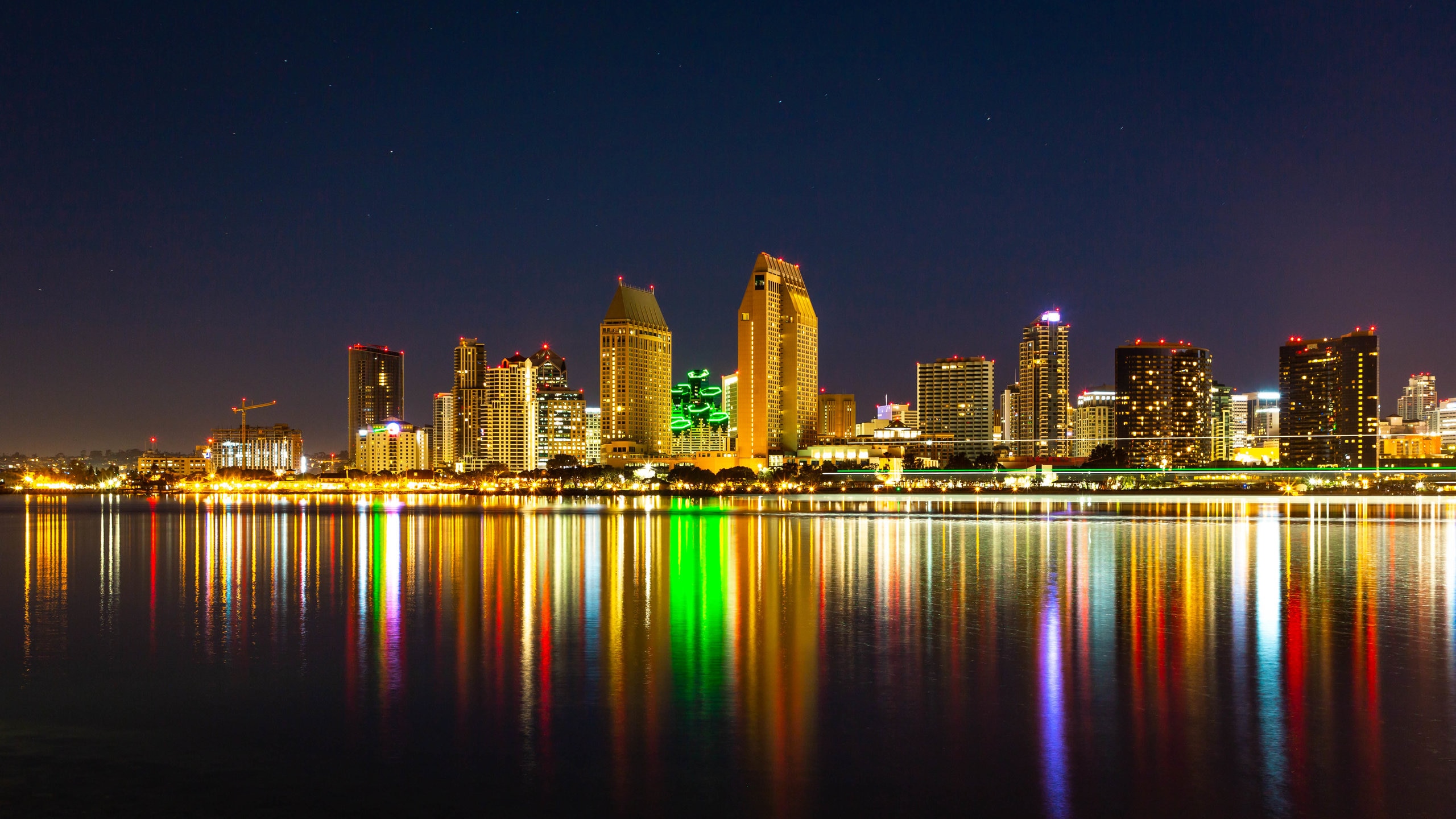 Centennial Park which includes night scenes, a bay or harbor and a city