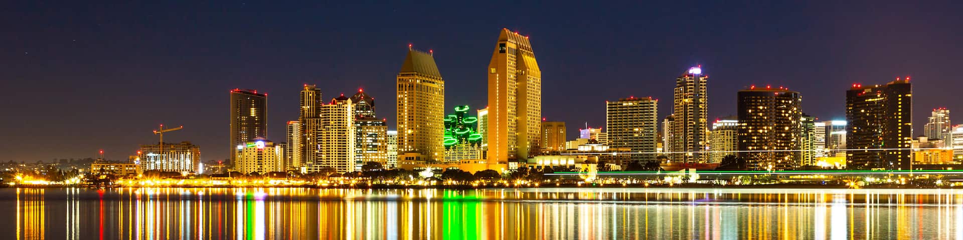 Centennial Park which includes night scenes, a bay or harbor and a city