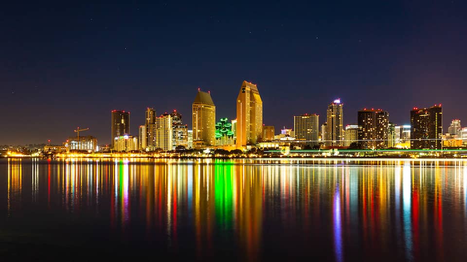 Centennial Park which includes night scenes, a bay or harbor and a city