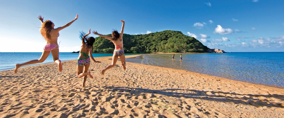 Ko Pha-ngan showing a sandy beach and general coastal views as well as a small group of people