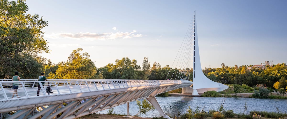 Sundial Bridge featuring a sunset, a bridge and a lake or waterhole
