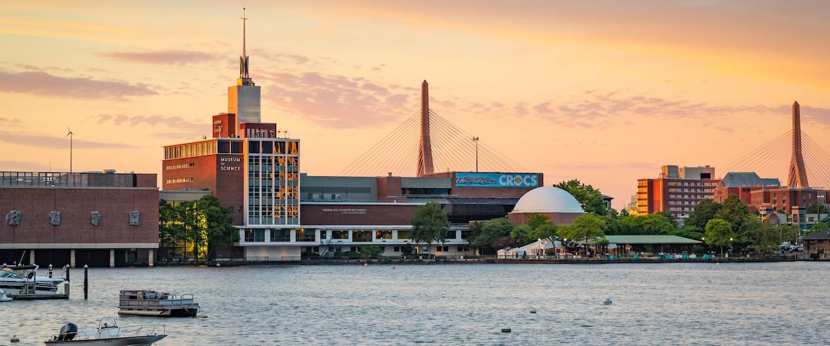 Museum of Science showing a sunset and a bay or harbor
