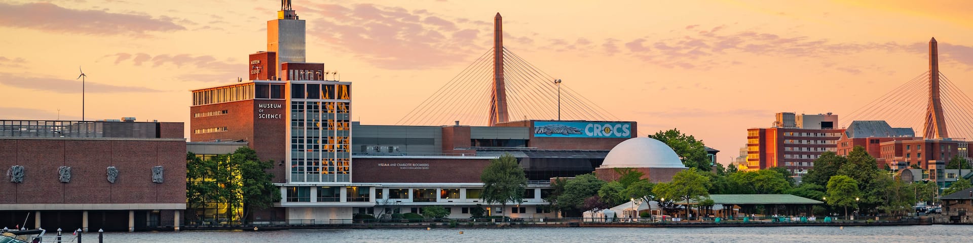 Museum of Science showing a sunset and a bay or harbor