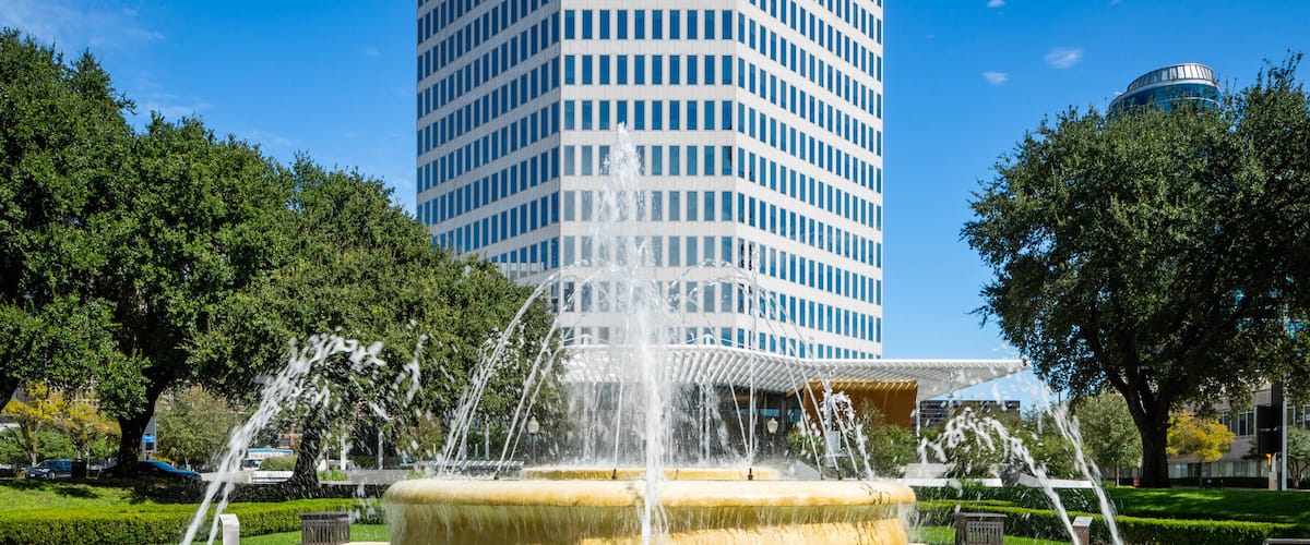 West End Historic District featuring a fountain and a skyscraper