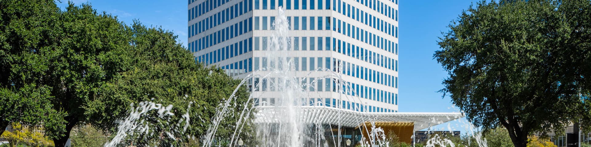 West End Historic District featuring a fountain and a skyscraper