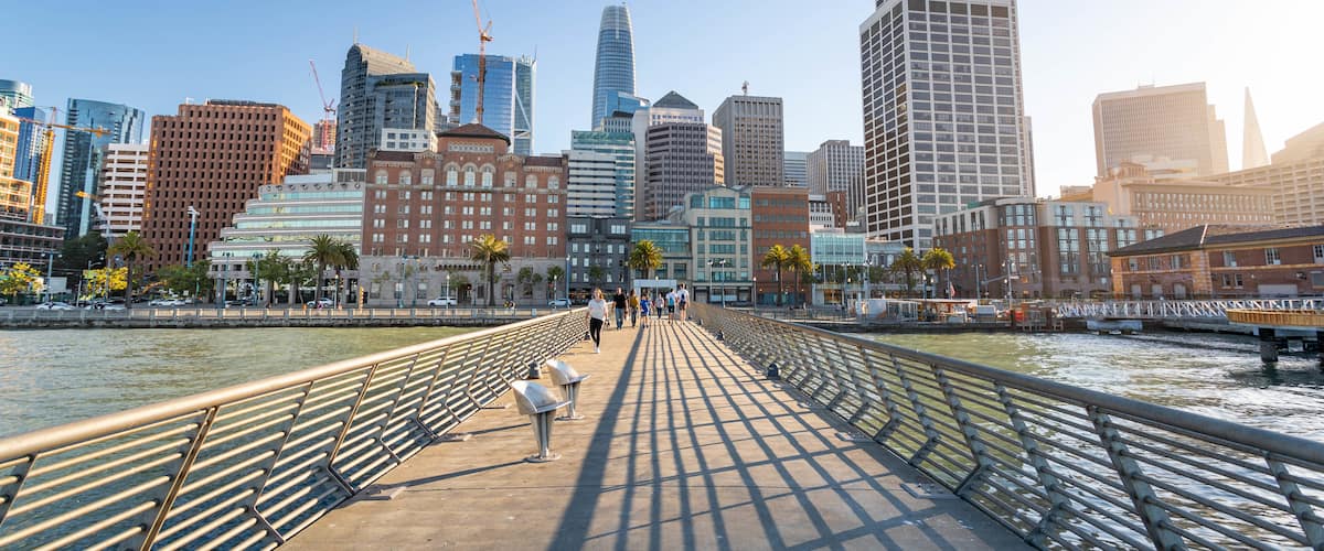 Embarcadero Plaza featuring a bridge, a sunset and a river or creek