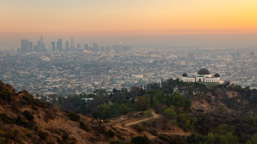 Griffith Park showing a sunset, landscape views and mist or fog