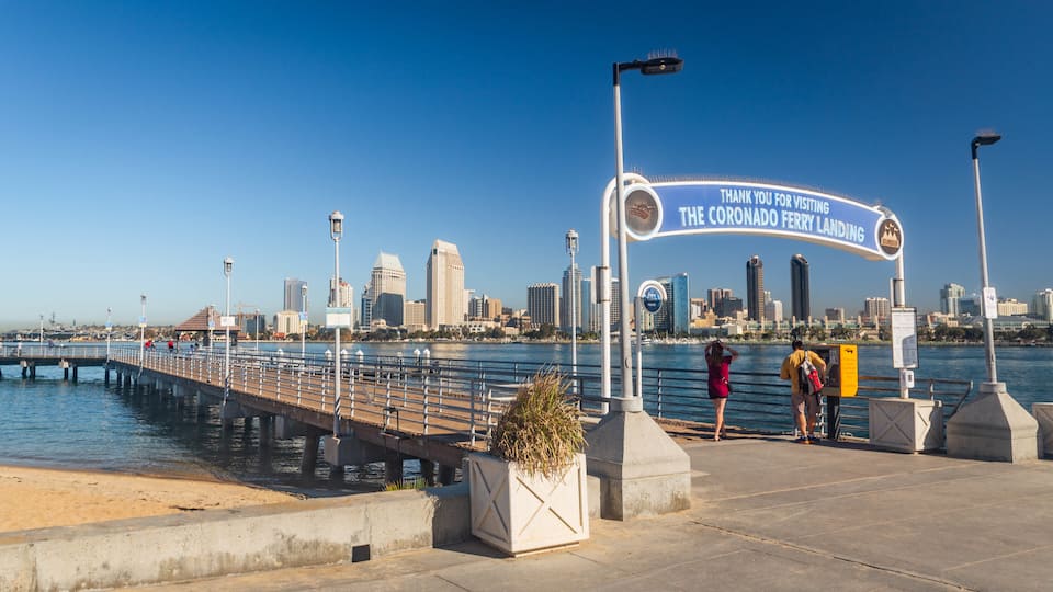 Coronado Ferry Landing showing signage and a bay or harbor