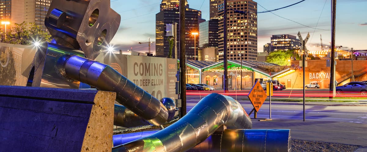 Deep Ellum featuring a city, night scenes and outdoor art