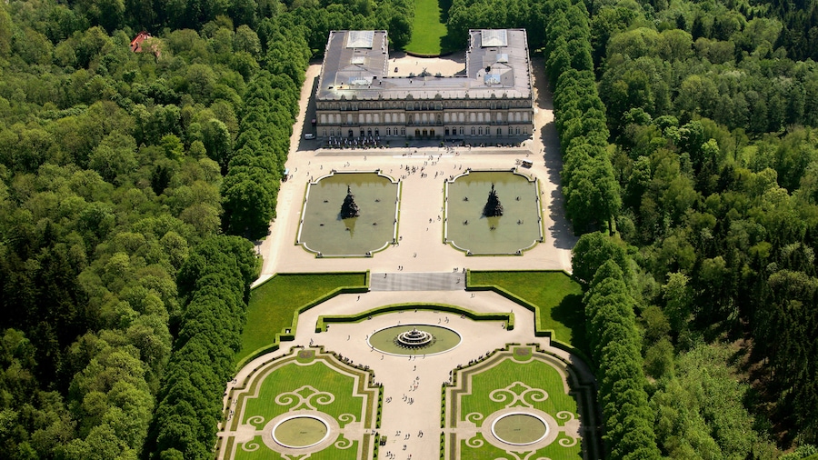 Herrenchiemsee Castle showing landscape views, a garden and heritage architecture