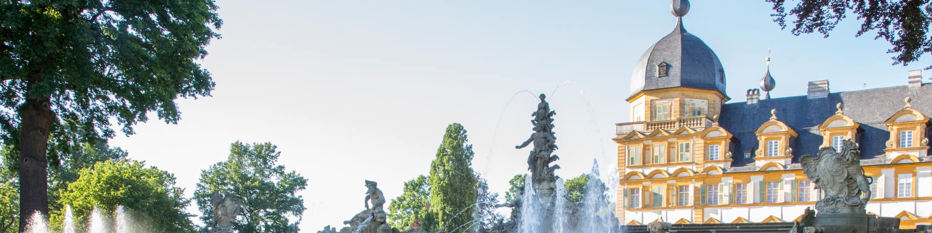 Seehof Palace featuring heritage architecture and a fountain