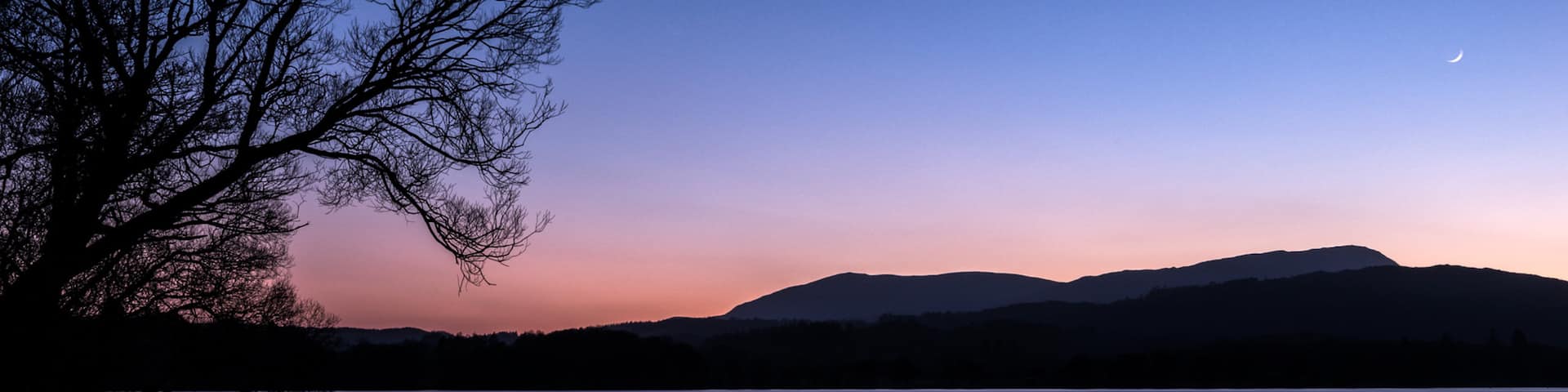 Lake District National Park which includes a sunset and a lake or waterhole