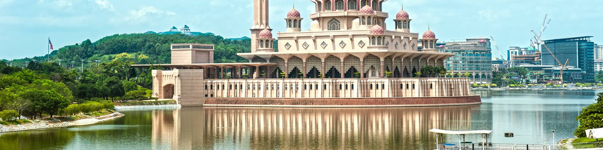 Putra Mosque showing a bay or harbor, heritage architecture and a mosque