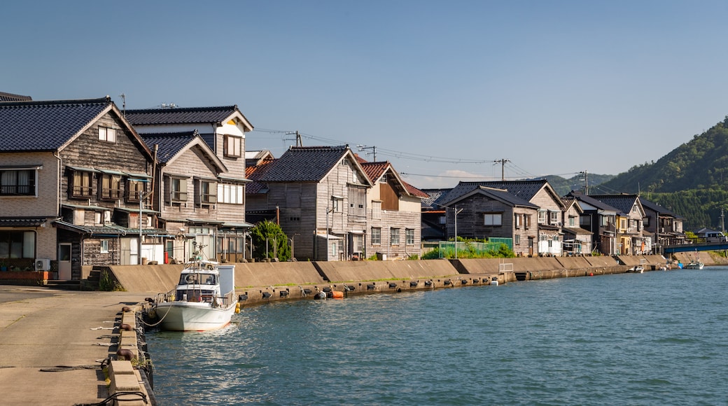 Takeno Beach featuring a coastal town and a bay or harbor