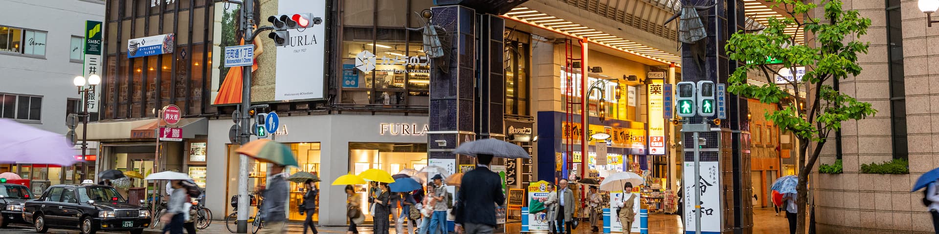Motomachi Shopping Street which includes street scenes, a city and signage