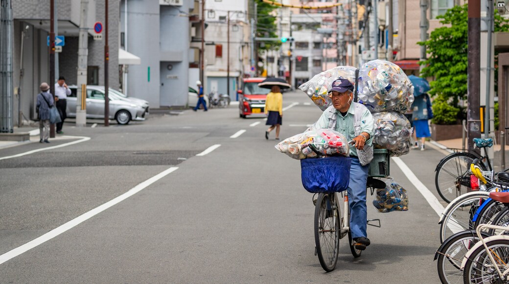 Sumiyoshi featuring street scenes and road cycling as well as an individual male