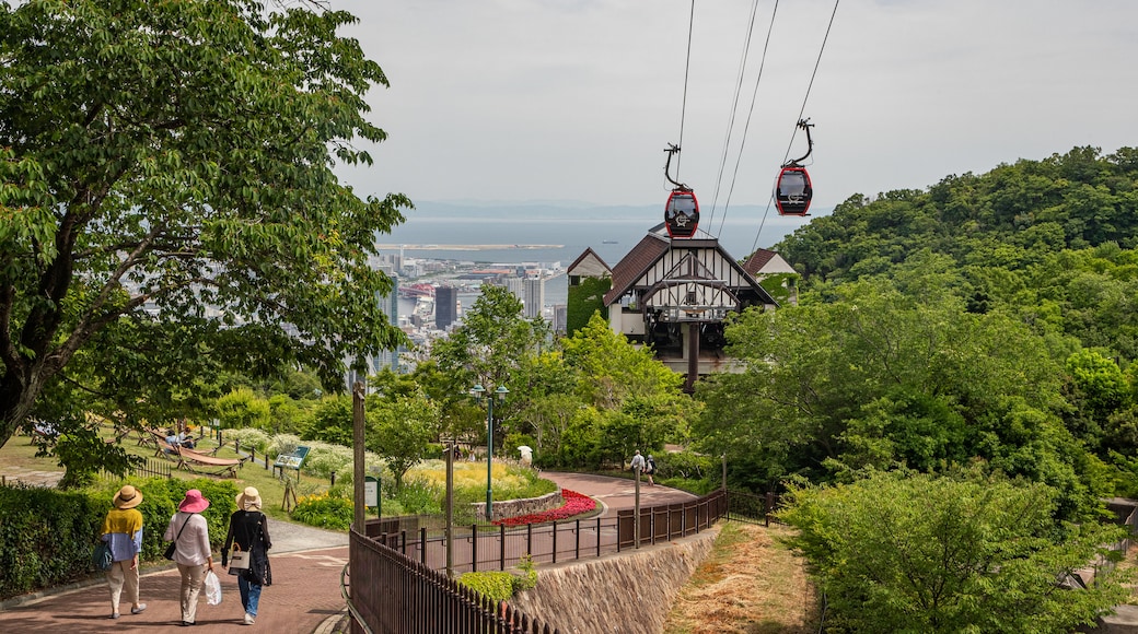 Shin-Kobe Ropeway showing a gondola and a garden as well as a small group of people