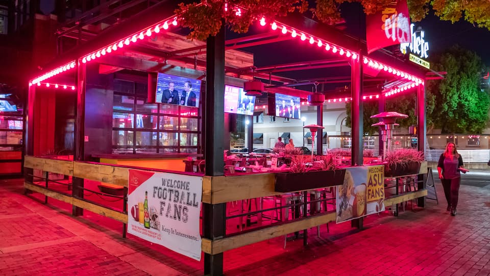 Mill Avenue District featuring night scenes and a bar