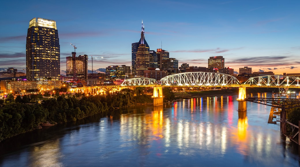 Downtown Nashville featuring a city, a sunset and a river or creek