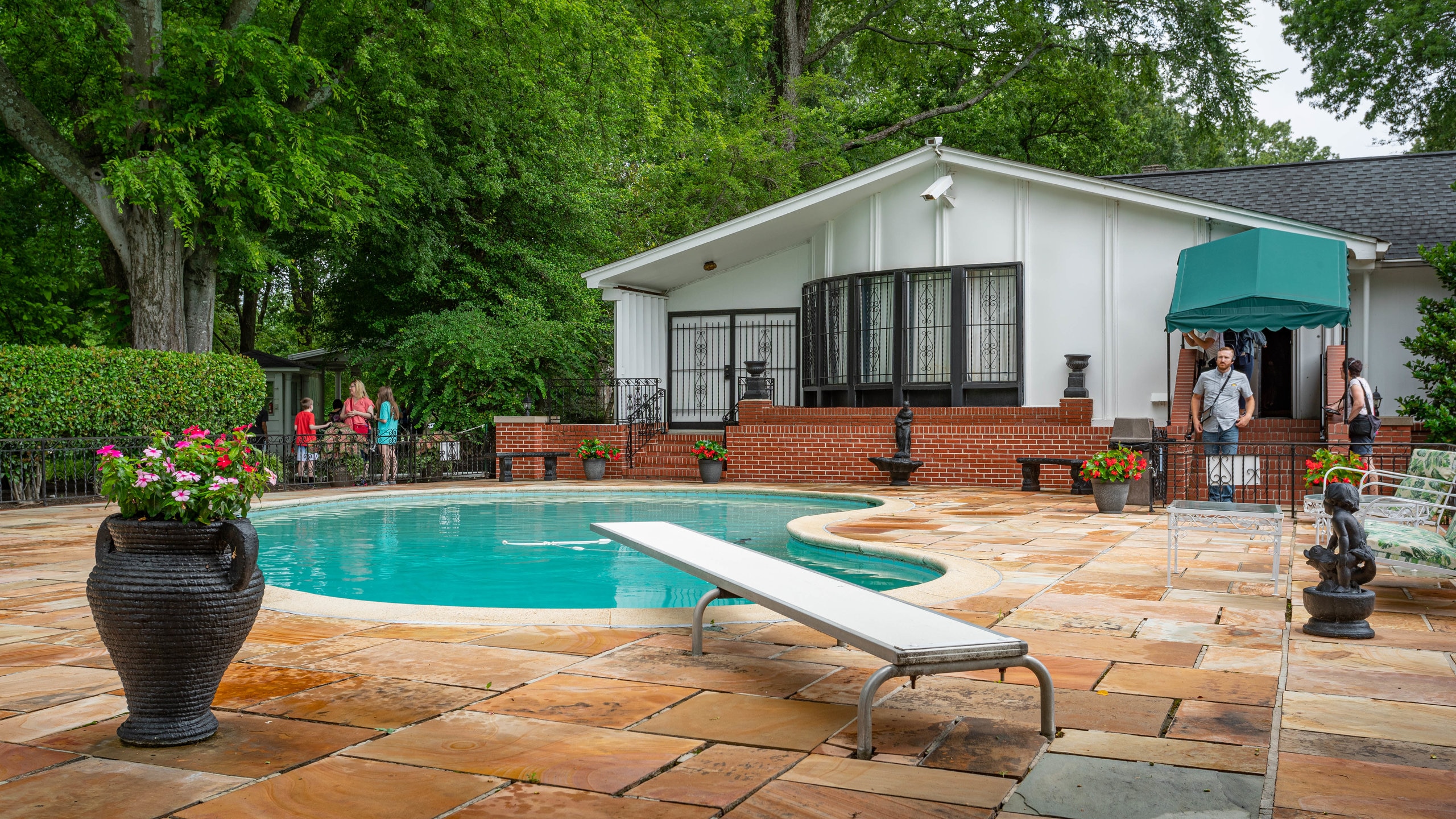 Graceland showing a house and a pool