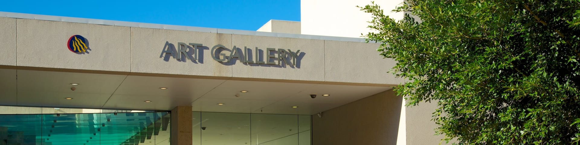 Queensland Art Gallery showing art, signage and a city