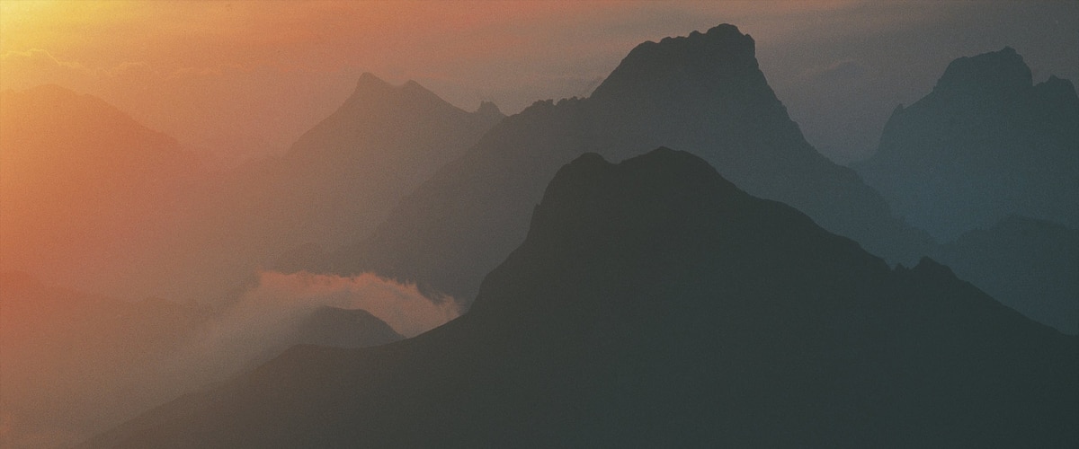 Lech am Arlberg which includes mountains, mist or fog and a sunset