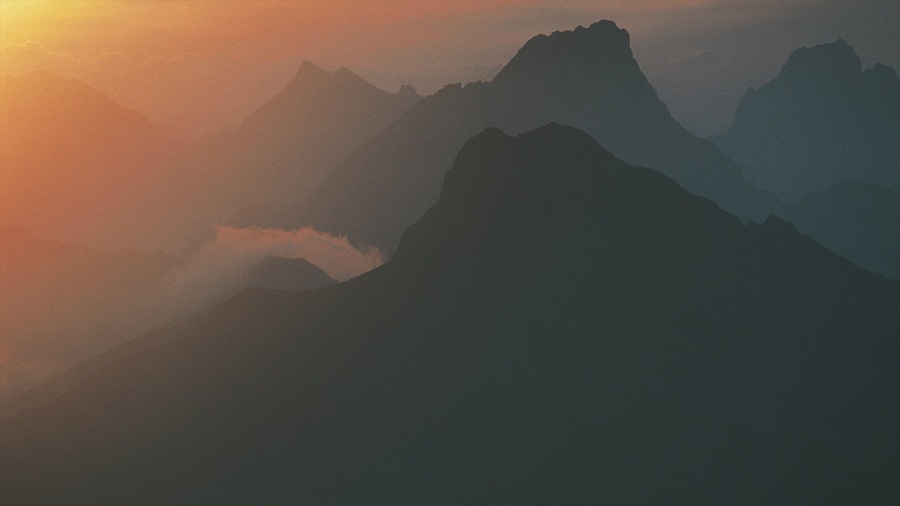 Lech am Arlberg which includes mist or fog, mountains and a sunset