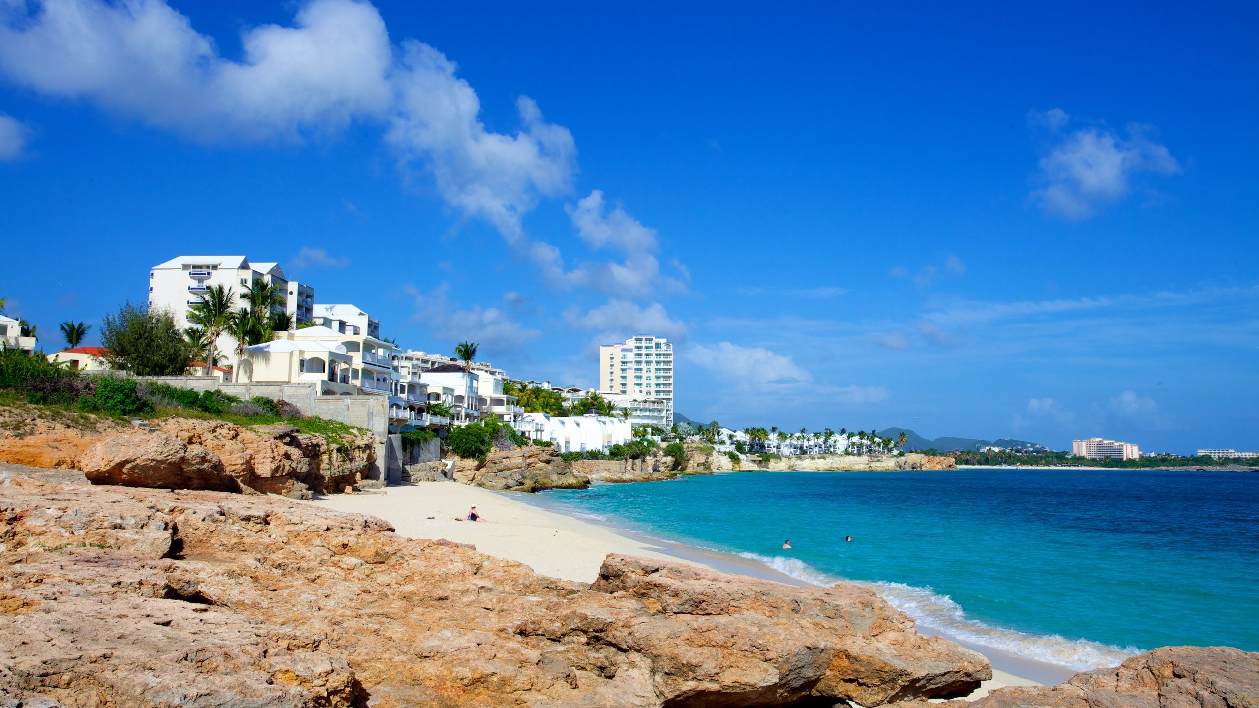 Sint Maarten showing a coastal town and a beach