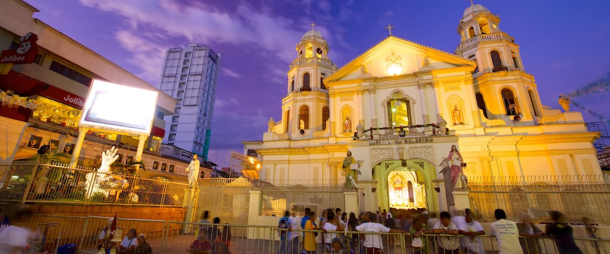 Quiapo Church which includes a city, night scenes and a church or cathedral