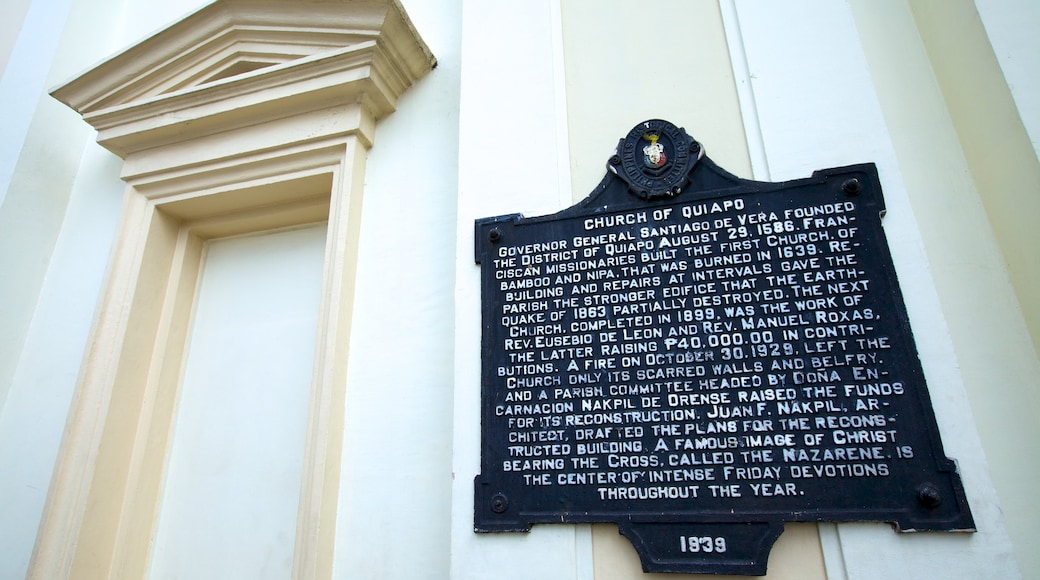 Quiapo Church featuring signage, a church or cathedral and religious elements