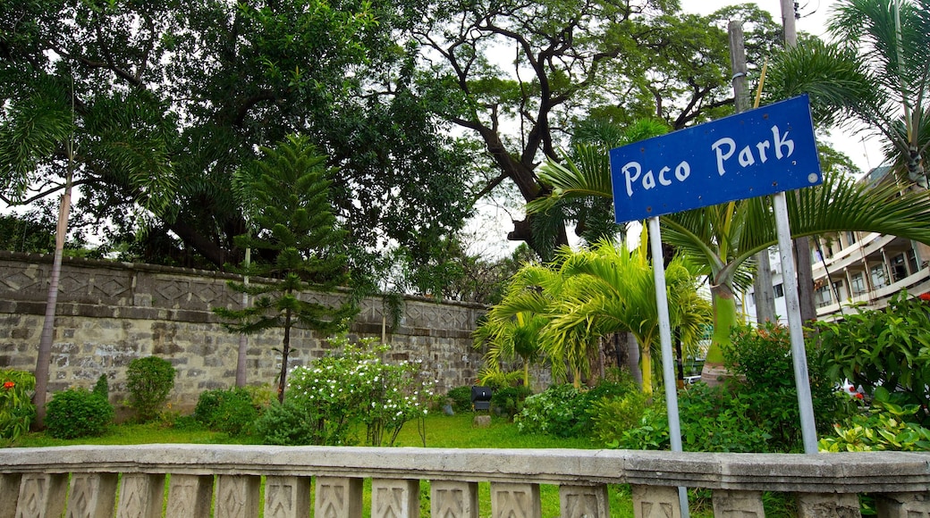 Paco Park showing a garden and signage