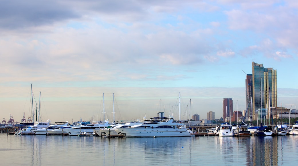 Baywalk showing a marina, a city and a coastal town