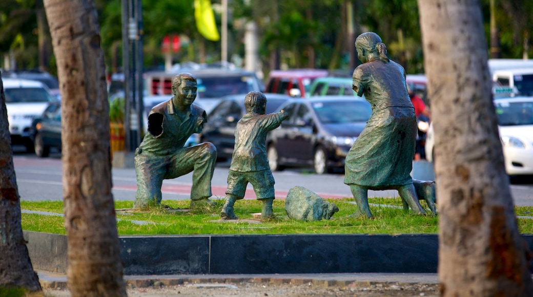 Baywalk showing a city, a statue or sculpture and outdoor art