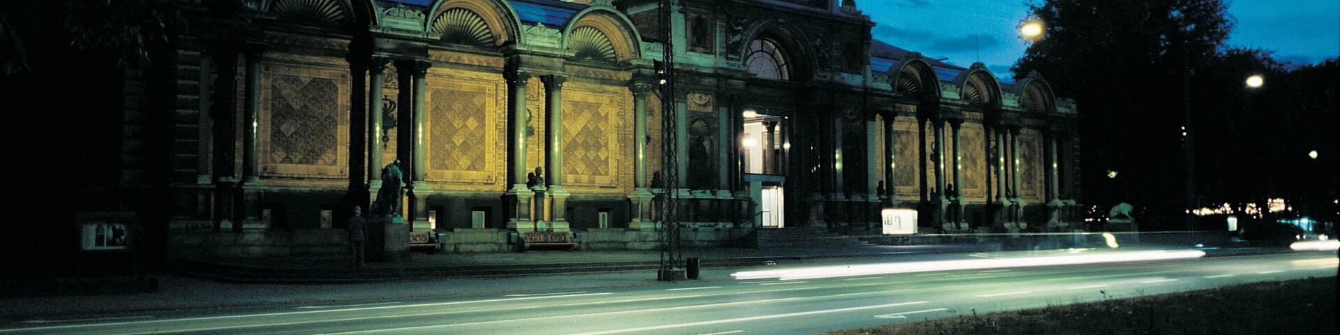 Ny Carlsberg Glyptotek which includes night scenes, street scenes and heritage architecture