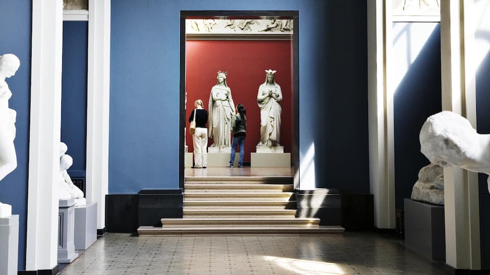 Ny Carlsberg Glyptotek featuring a statue or sculpture and interior views