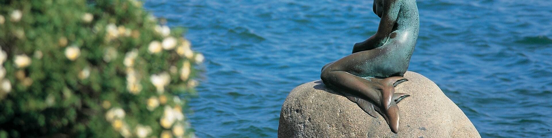 Little Mermaid featuring a river or creek, a statue or sculpture and boating